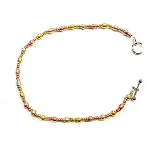 Gold, bronze, and silver anklet